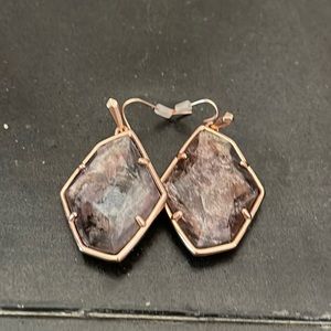 Brown Kendra Scott earrings.
